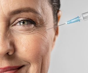 smiley-elder-woman-using-injection-for-her-eye-wrinkles